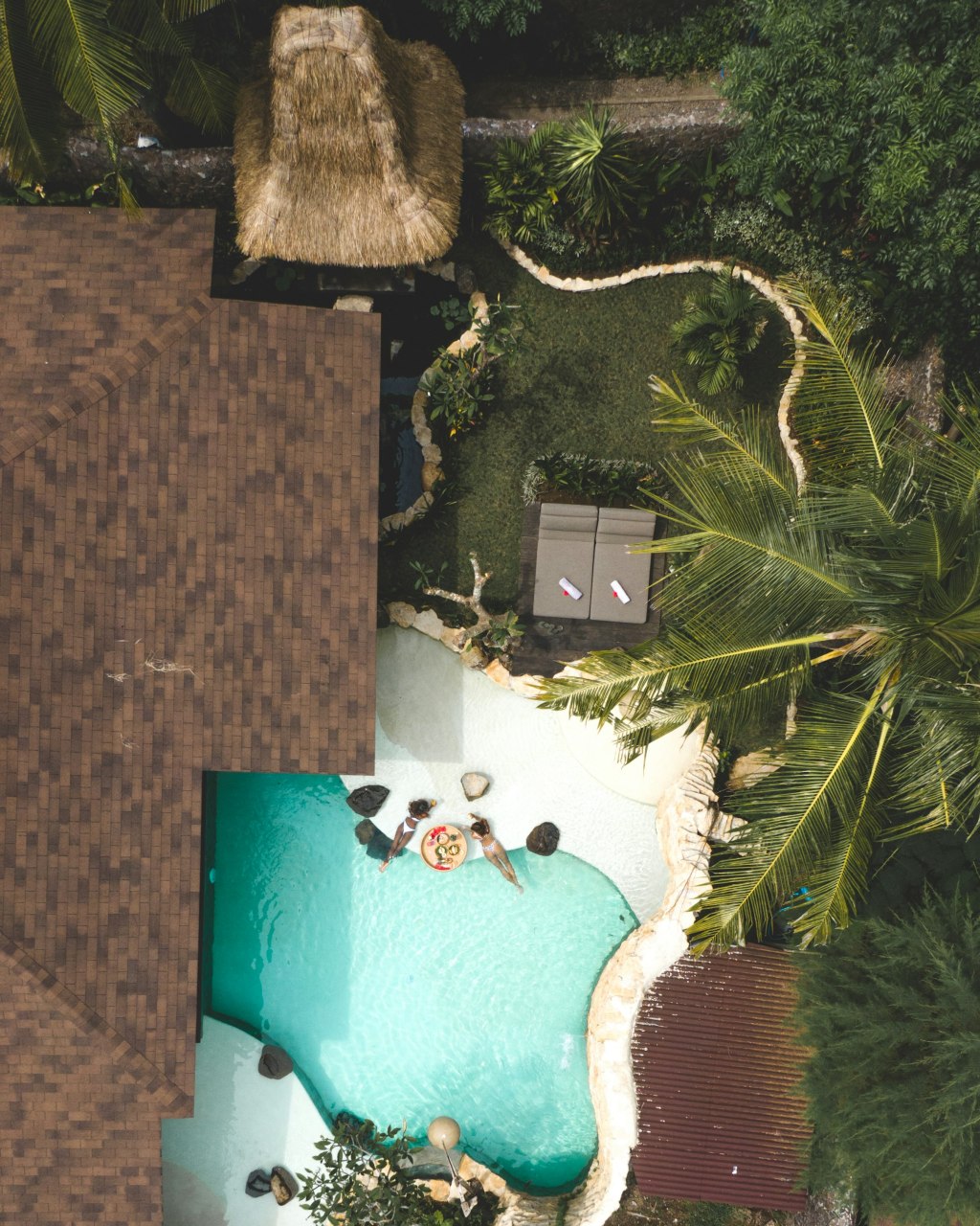 Pool villa among palm trees